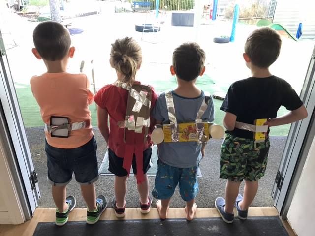 Children dressed as astronauts with homemade jetpacks