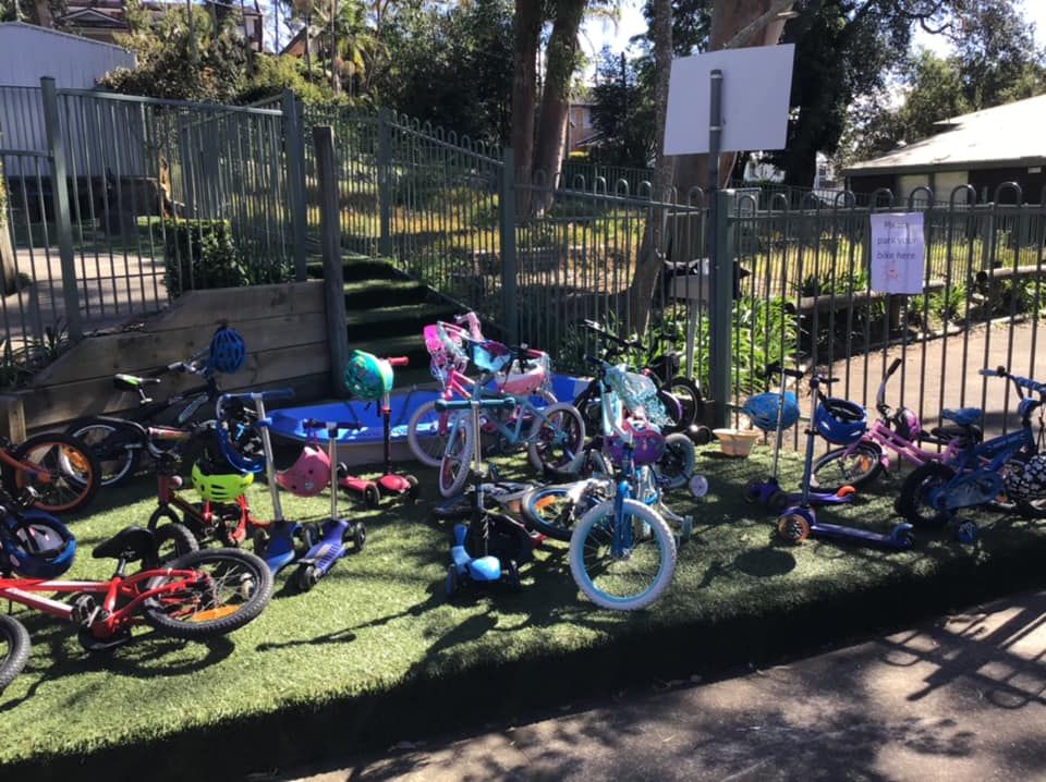 Bikes and scooters parked in the garden