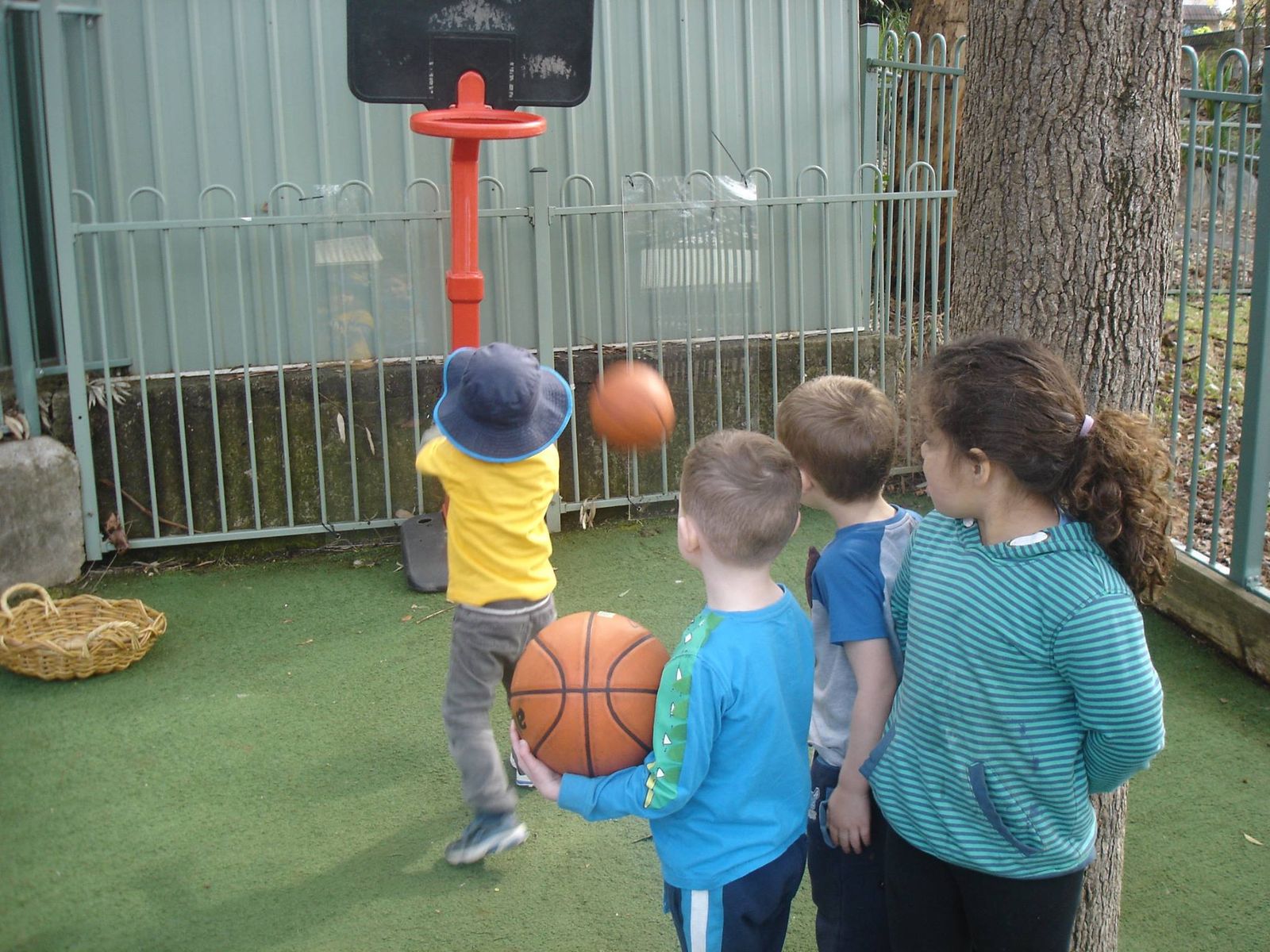 Children playing basketball