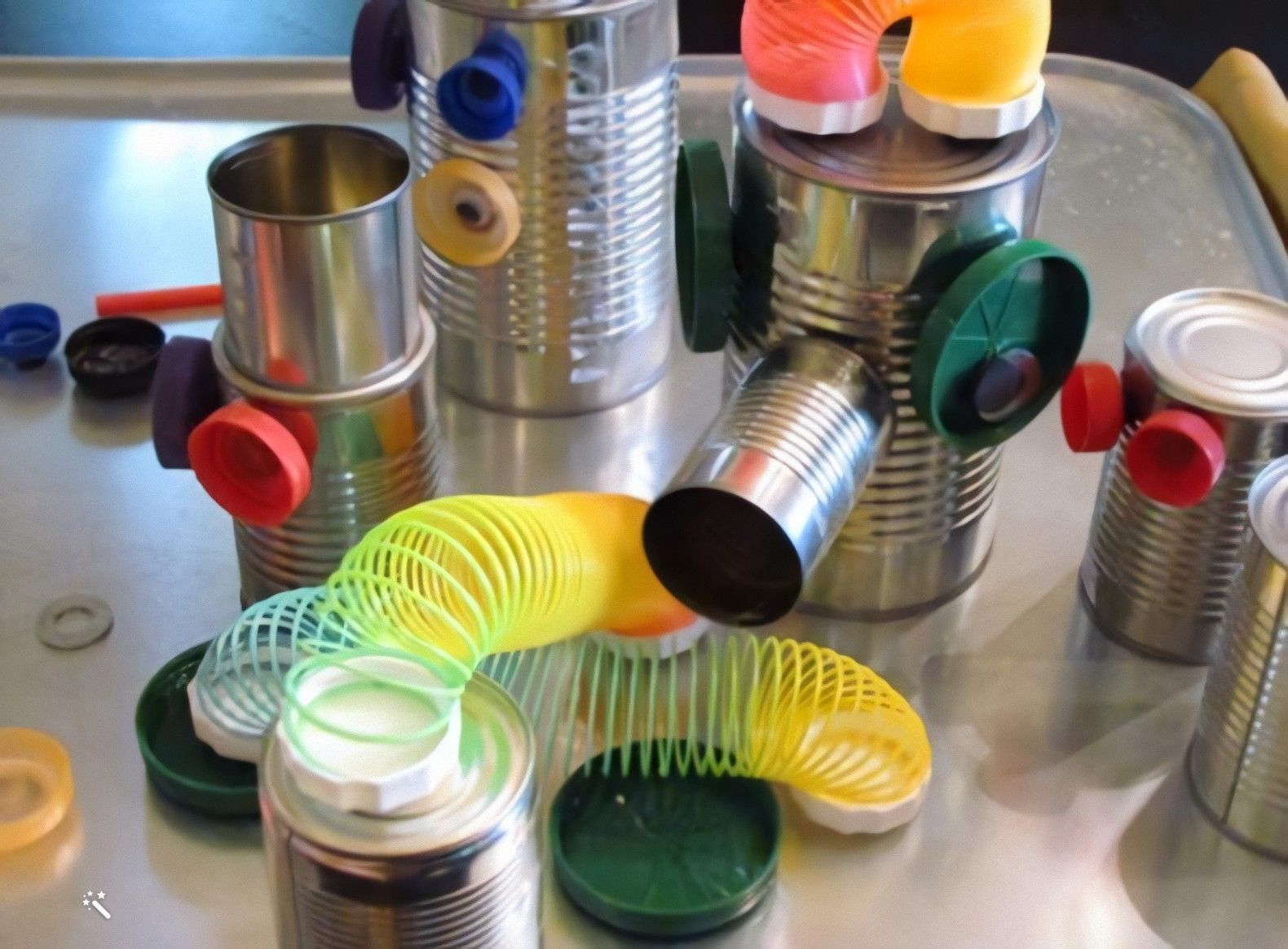 A robot the children built from tins and bottle tops
